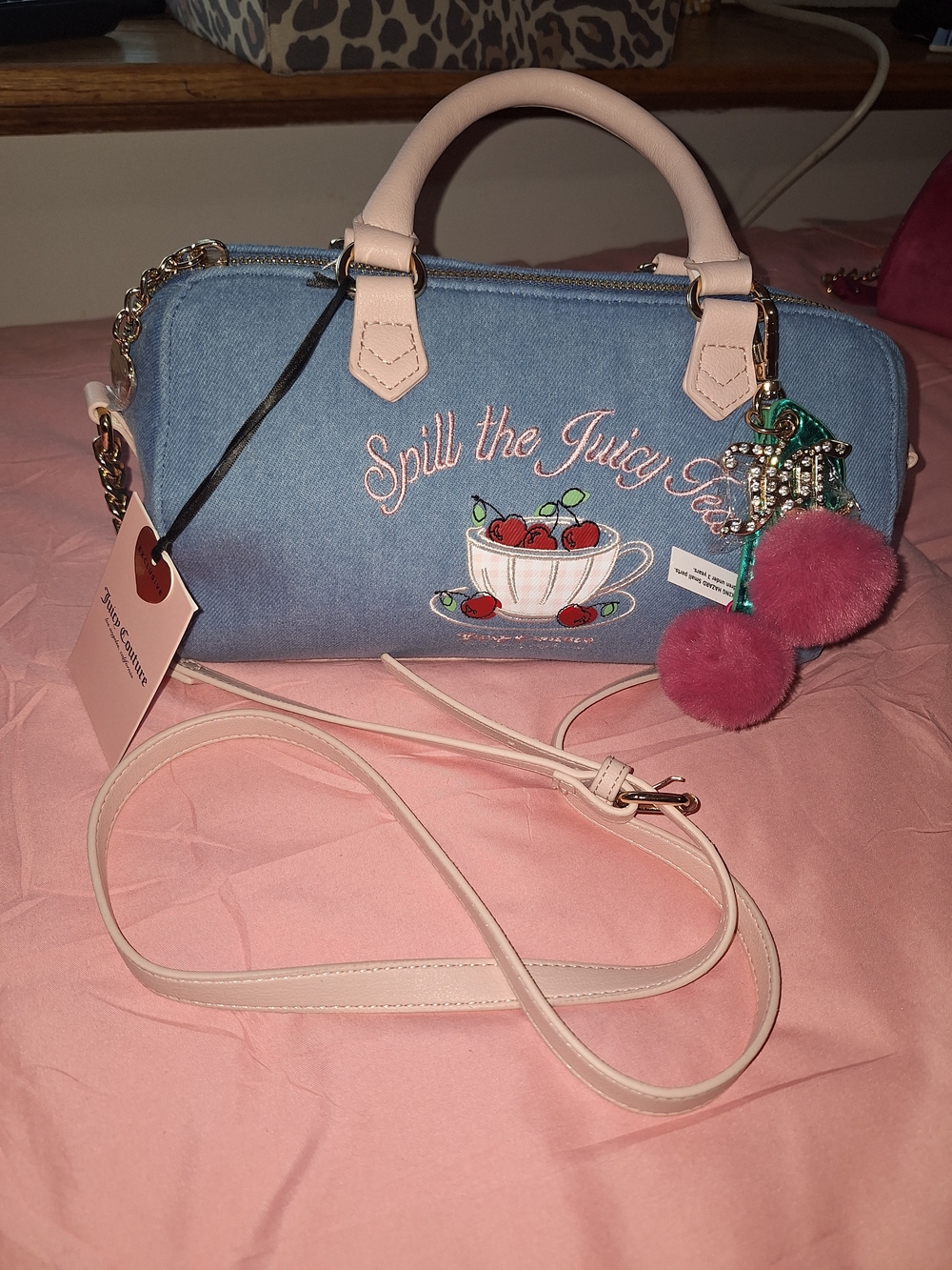 EXCLUSIVE Juicy Couture Denim Cherry Crossbody with Pink Trim and Pom